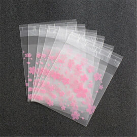 Rózsaszín virág mintás matt celofán tasak, ajándék zacskó, 9,5x7 cm