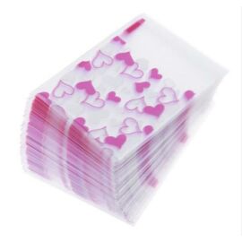 Rózsaszín és fehér szív mintás celofán tasak, ajándék zacskó, 9,5x7 cm