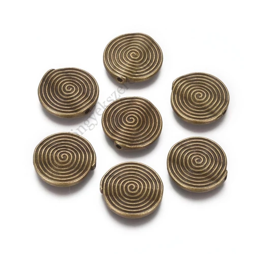 Csigavonalas köztes, antik bronz színű, 17 mm