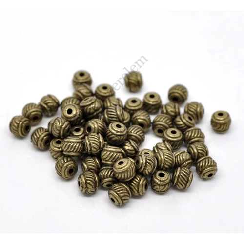 Csíkos köztes gyöngy, antik bronz színű, 6x5 mm