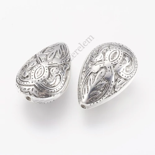 Mintás csepp köztes, antik ezüst színű, műanyag, 27x17x11 mm
