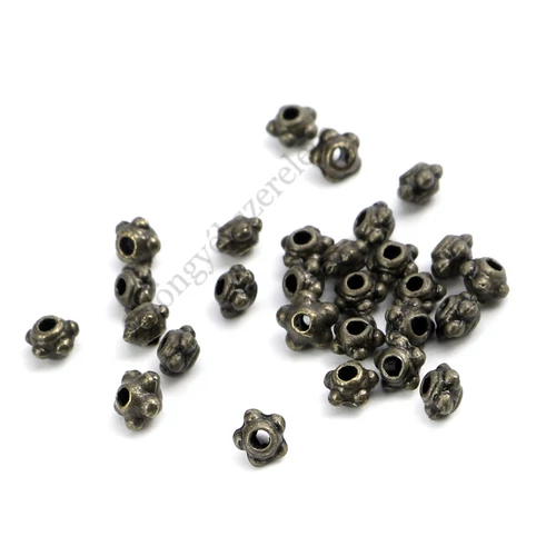 Pöttyös köztes gyöngy, antik bronz színű, 4 mm, 50 db/cs