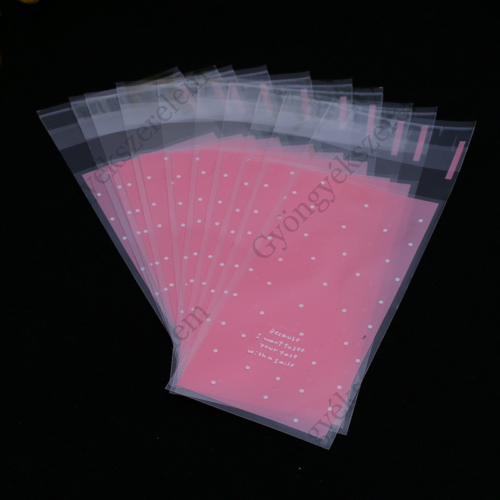 Rózsaszín, pöttyös celofán tasak, ajándék zacskó, 12,5x5 cm