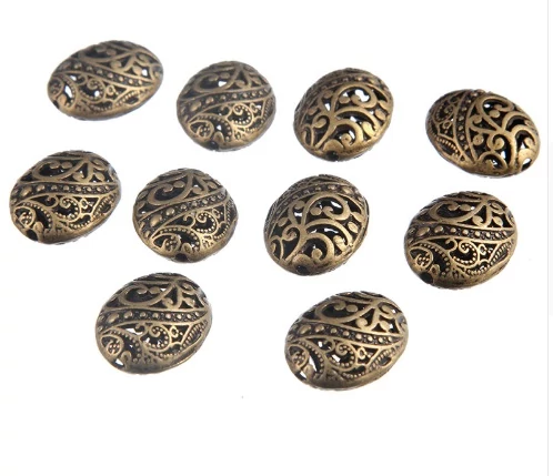 Áttört ovális köztes, antik bronz színű, 22x17x11 mm