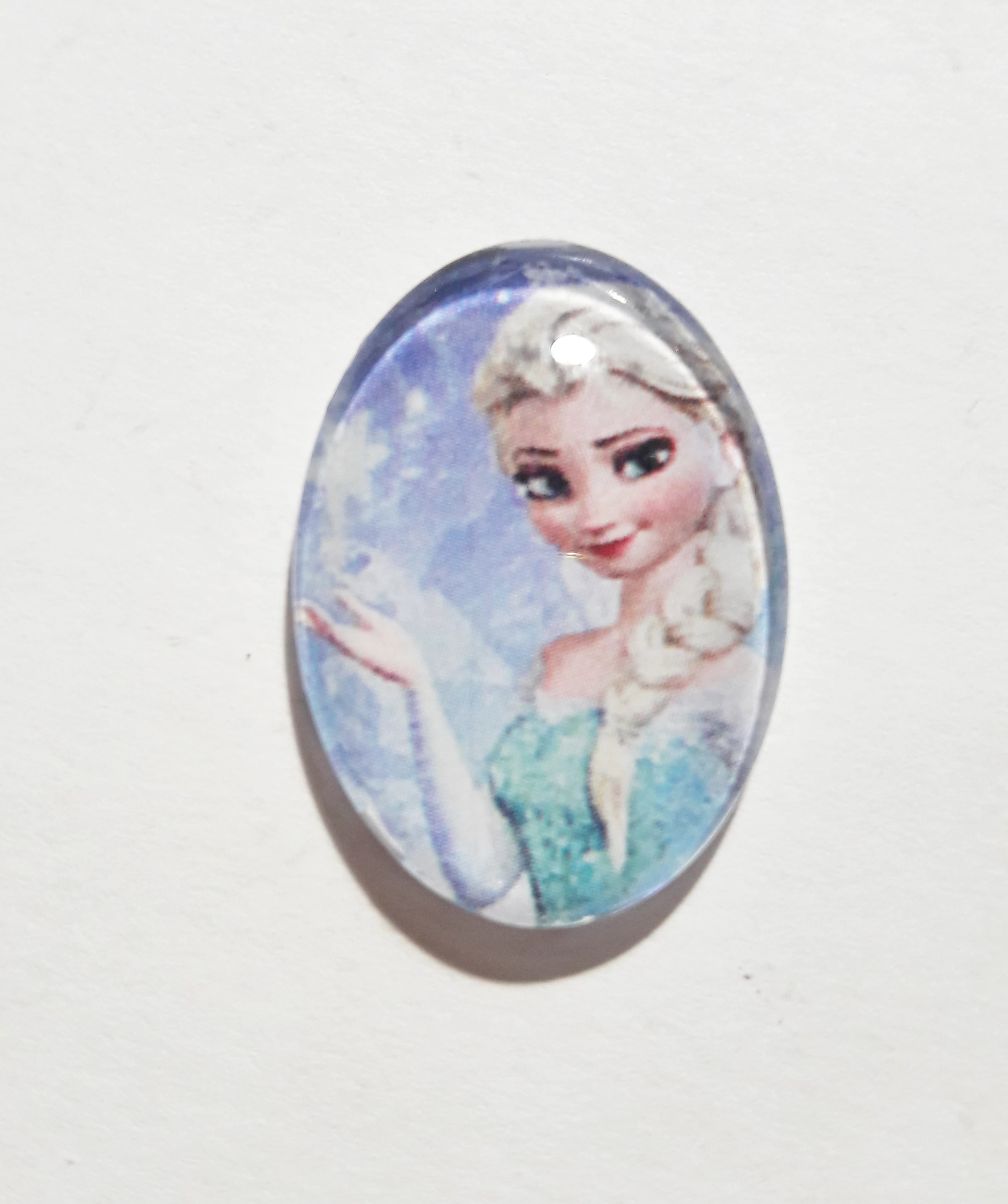 Jégvarázs, Elza mintás üveglencse, kaboson, 25x18 mm