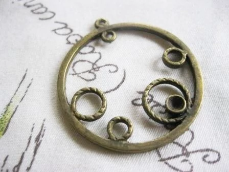 Körös medál, antik bronz színű, 38x35 mm