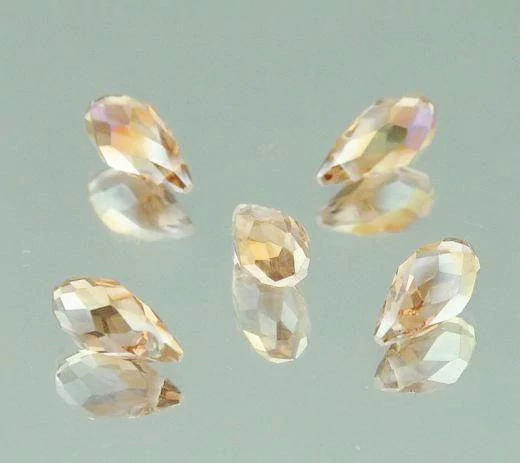 Pezsgő sárga lüszteres csiszolt csepp üveg gyöngy, 12x6 mm