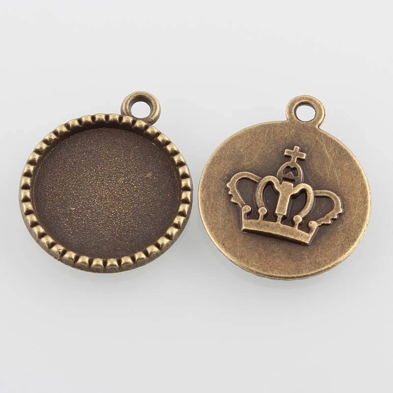 Kerek, korona mintás medálalap, antik bronz színű, 26x22 mm, 18 mm-es lencséhez