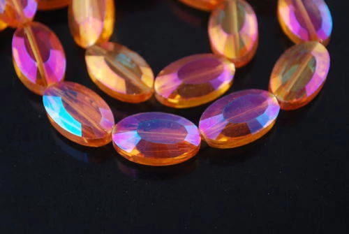 Narancs rózsaszín színjátszó, csiszolt ovális üveg gyöngy, 22x13x8 mm
