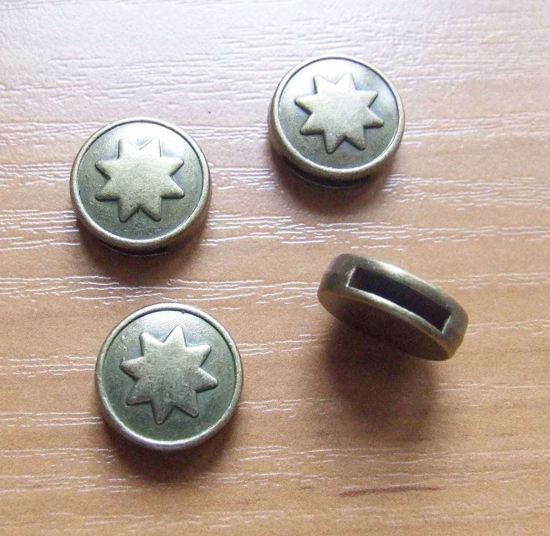 Csillagos korong köztes, antik bronz színű, 17x6 mm
