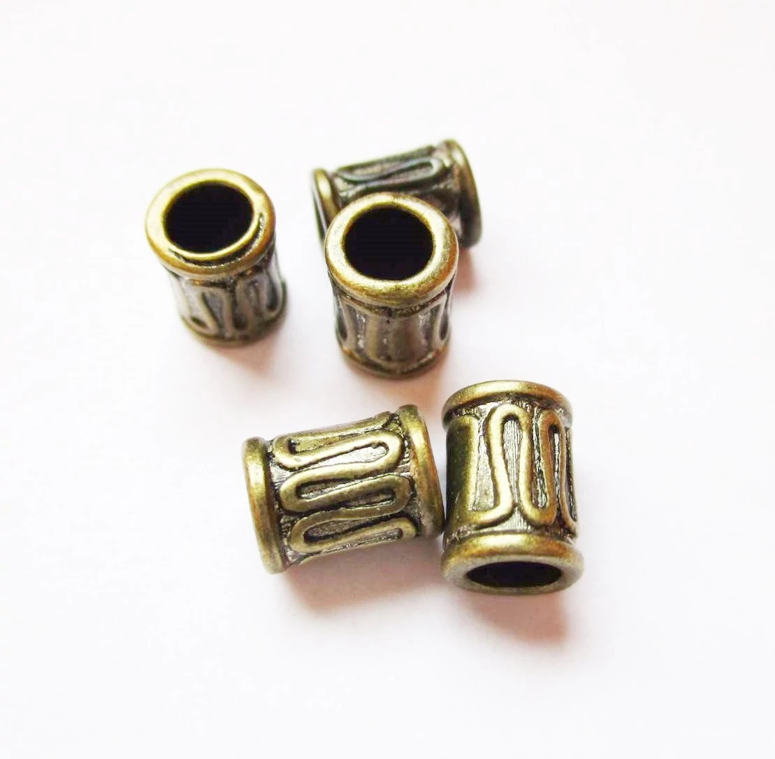 Hullámos henger köztes, antik bronz színű, 8x5 mm
