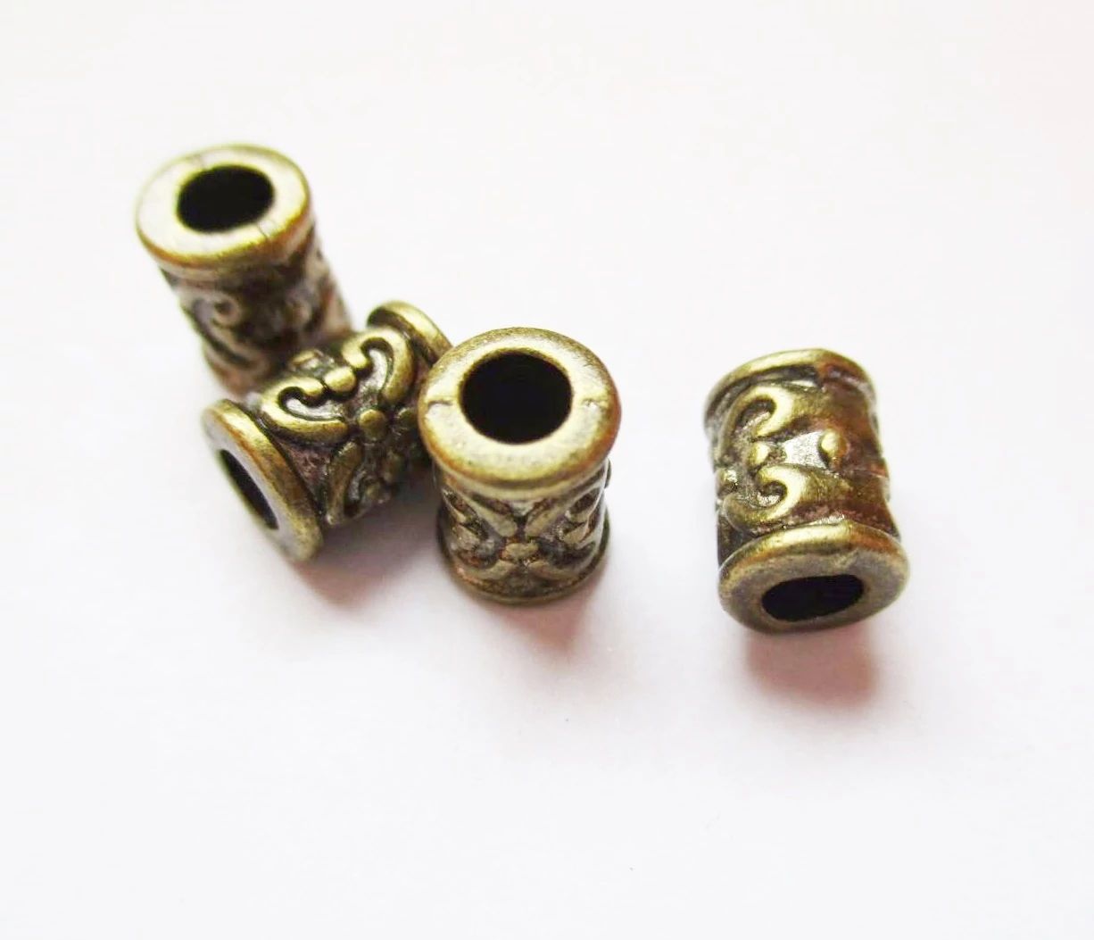 Díszes henger köztes, antik bronz színű, 7x5 mm