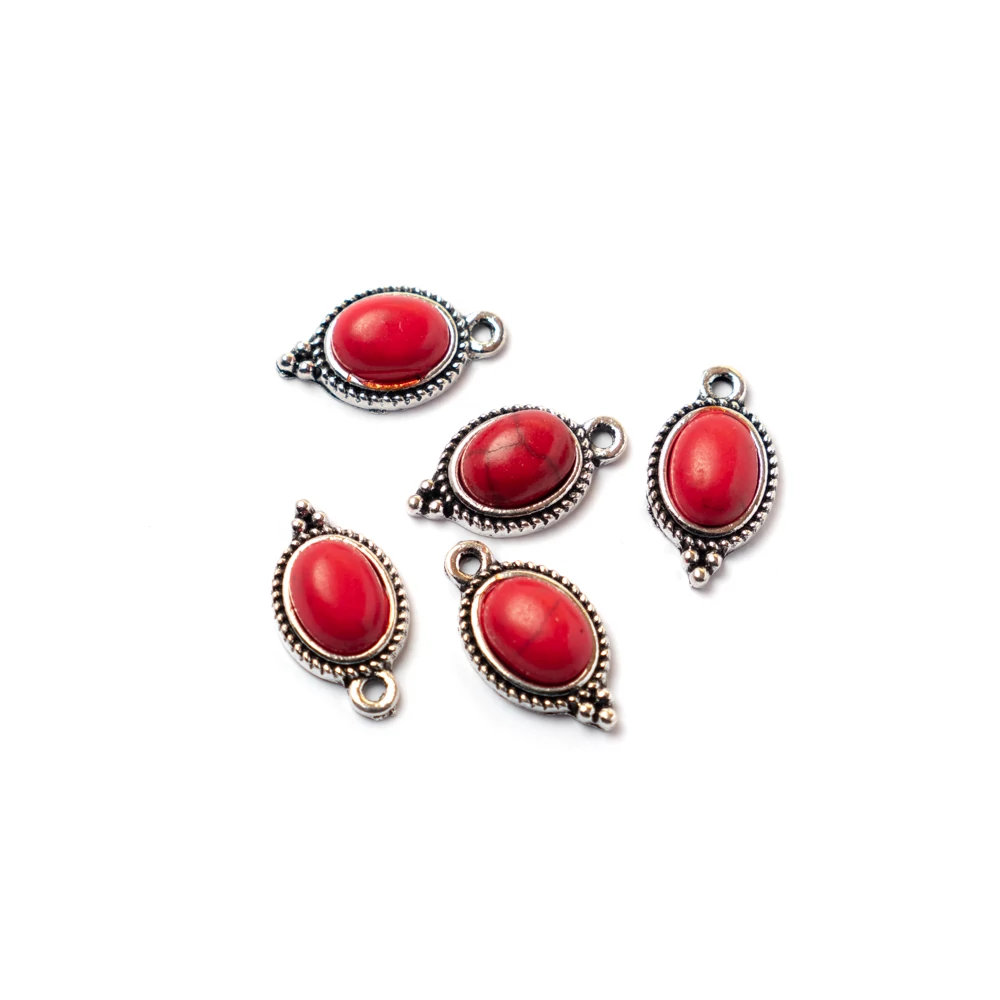 Ovális fityegő, medál piros, imitált türkiz kabosonnal, antik ezüst színű, 16x10 mm