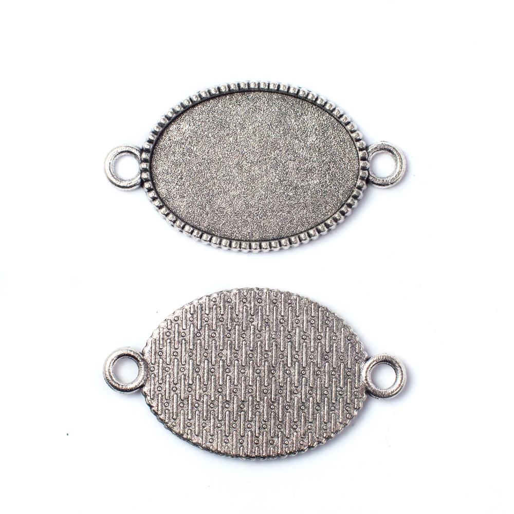 Ovális összekötő, medálalap, karkötőalap, 25x18 mm-es lencséhez, antik ezüst színű, 36x20 mm