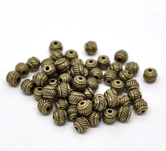 Csíkos köztes gyöngy, antik bronz színű, 6x5 mm