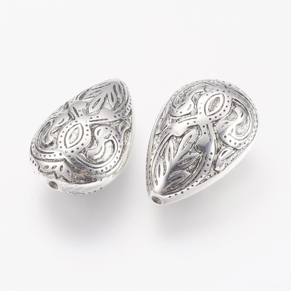 Mintás csepp köztes, antik ezüst színű, műanyag, 27x17x11 mm