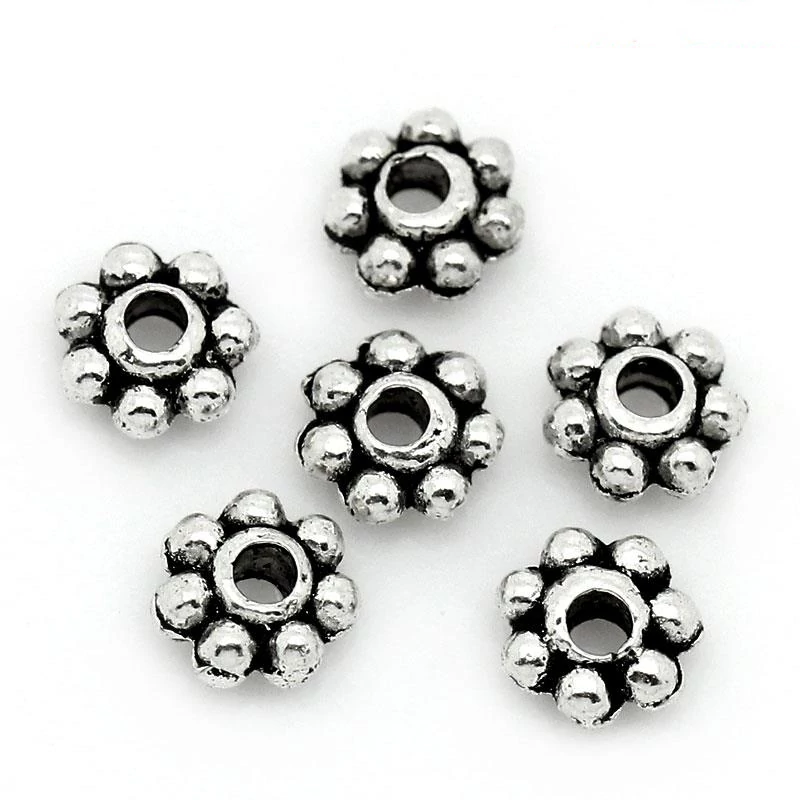 Kis virág köztes, antik ezüst színű, 4 mm, 50 db/cs