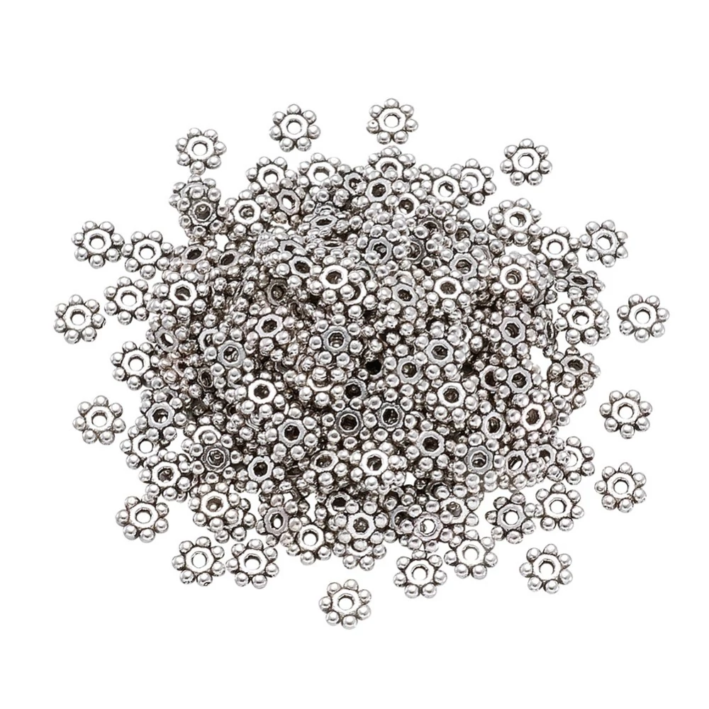 Kis virág köztes, antik ezüst színű, 4 mm, 50 db/cs