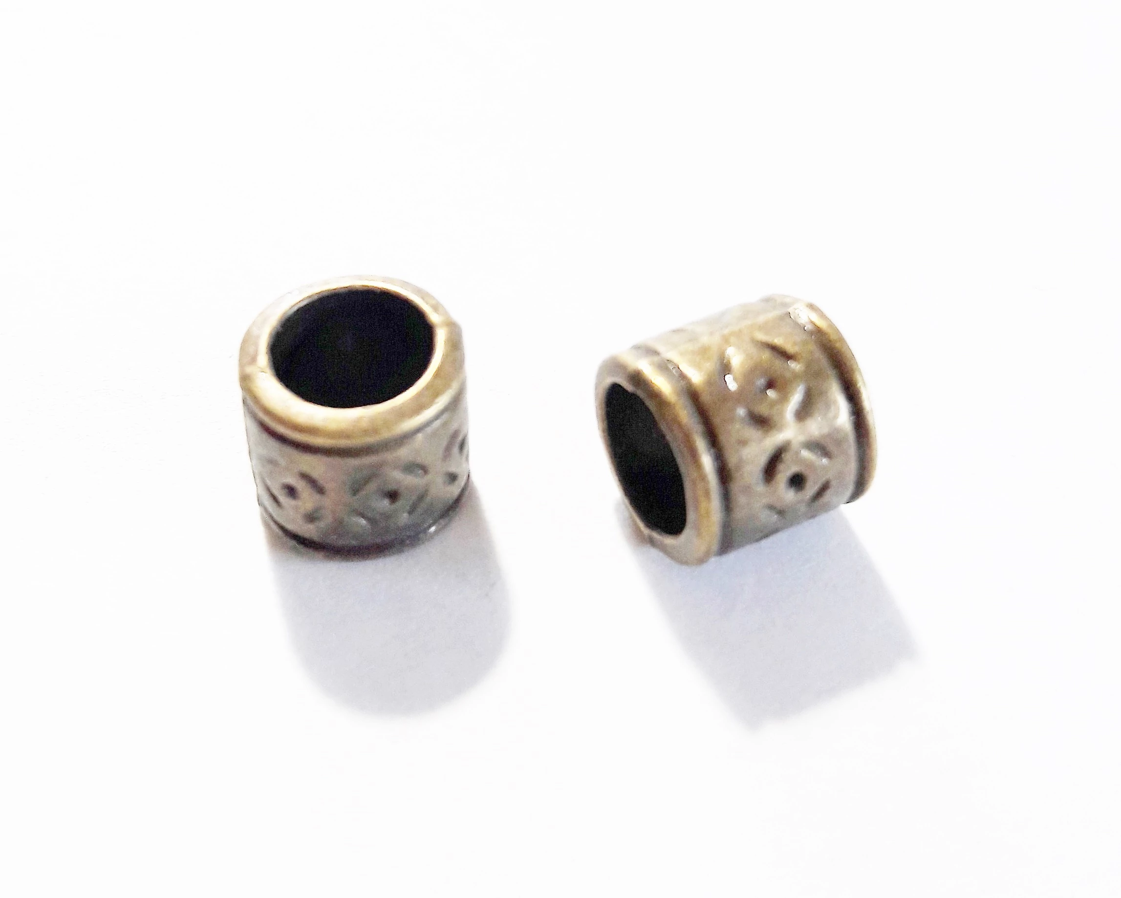 Mintás henger köztes, antik bronz színű, 8x7 mm
