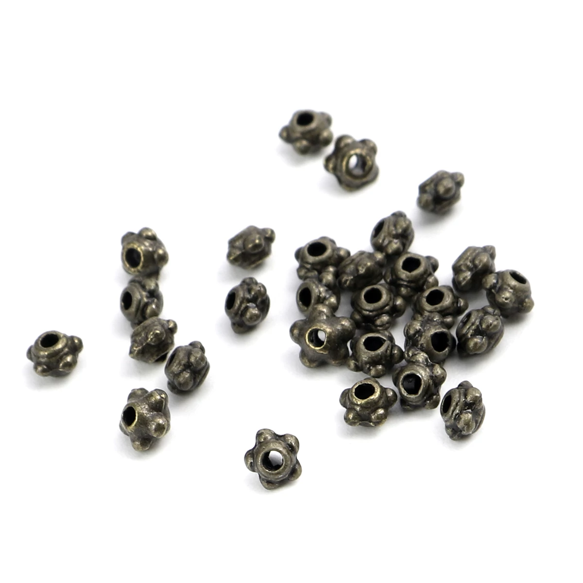 Pöttyös köztes gyöngy, antik bronz színű, 4 mm, 50 db/cs