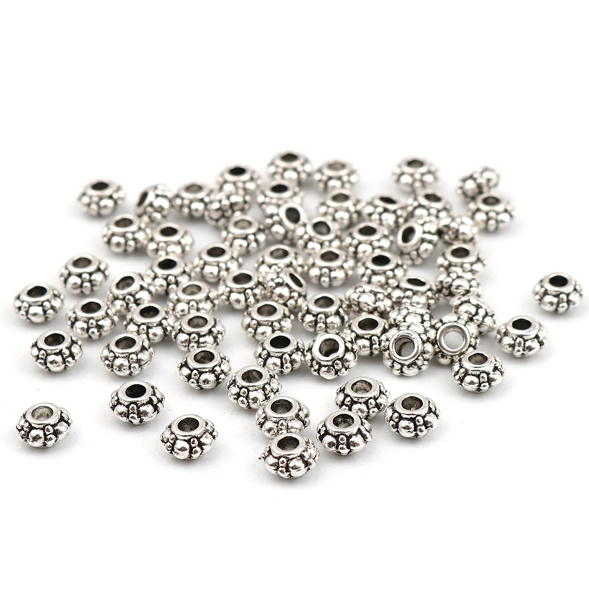 Pöttyös köztes, antik ezüst színű, 6x4 mm