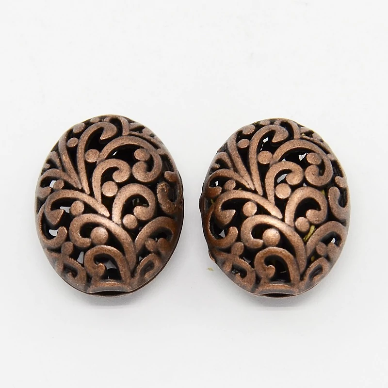 Áttört ovális köztes, vörösréz színű, 22x17x13 mm