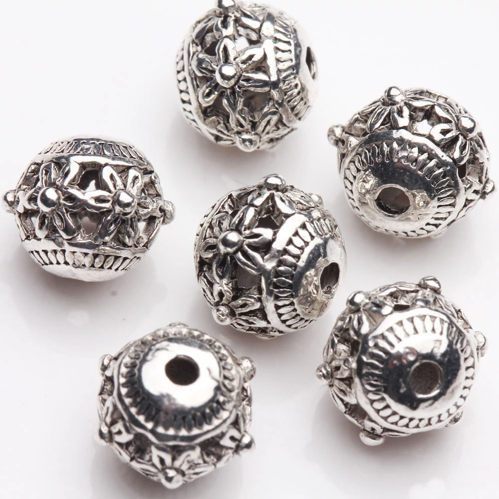 Virág mintás áttört köztes, antik ezüst színű, 9 mm